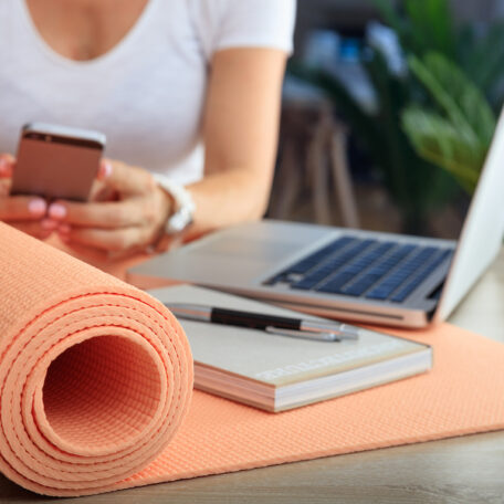 Relax at work concept. Yoga mat in an office desk